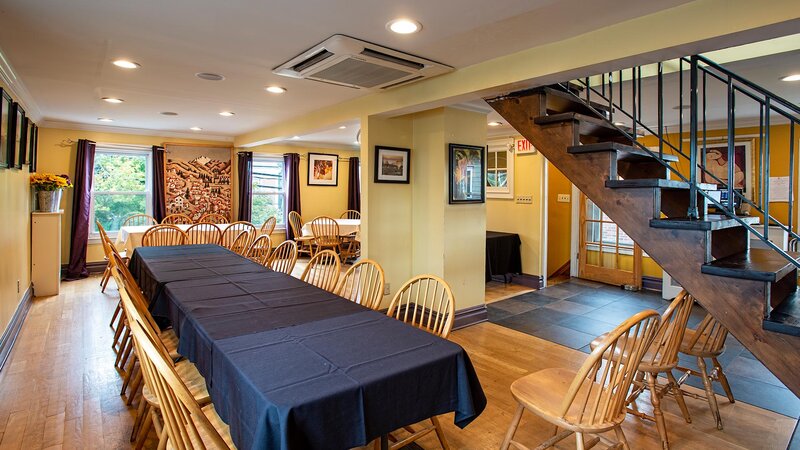 Downstairs dining room with long tables